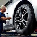 Technician performing tire rotation